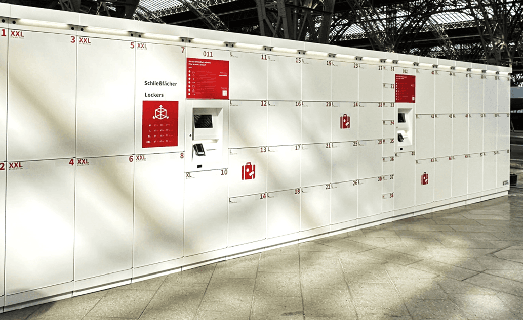 A white luggage locking system from the provider Mobile Locker at a station.